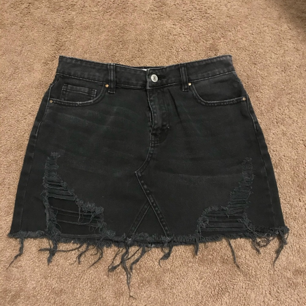 Black denim skirt with rips